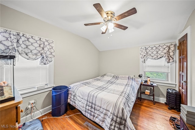3906 Redfern Rd, Parma, OH 44134 - bedroom with lofted ceiling, wood finished floors, baseboards, and a ceiling fan