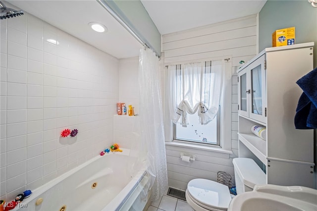 3906 Redfern Rd, Parma, OH 44134 - bathroom with a combined bath / shower with jetted tub, toilet, tile patterned flooring, and a sink