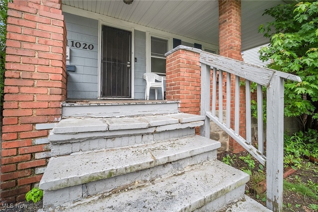 11020 Woodstock Ave, Cleveland, OH 44104 - entrance to property with a porch