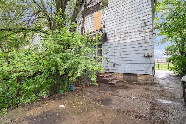 11020 Woodstock Ave, Cleveland, OH 44104 - view of side of property featuring entry steps