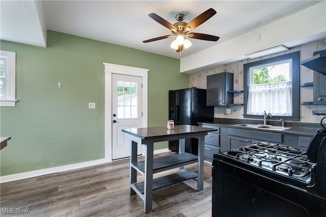 321 Cornell Ave, Youngstown, OH 44507 - kitchen with a sink, dark countertops, open shelves, a ceiling fan, and dark wood-style flooring
