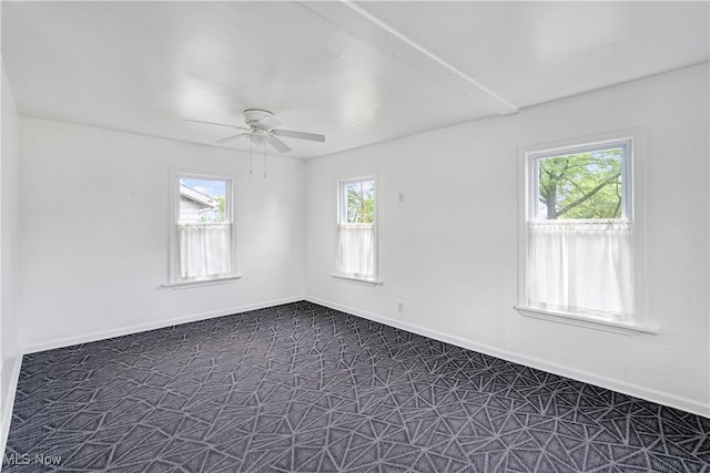 321 Cornell Ave, Youngstown, OH 44507 - empty room featuring ceiling fan, dark carpet, and baseboards