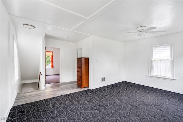 321 Cornell Ave, Youngstown, OH 44507 - spare room featuring a ceiling fan, dark wood-style flooring, and baseboards