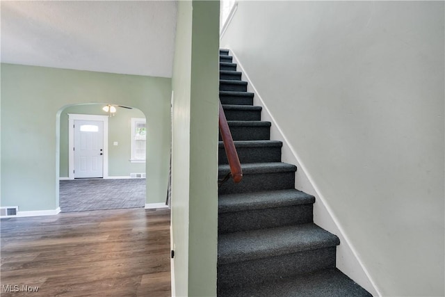 321 Cornell Ave, Youngstown, OH 44507 - staircase with arched walkways, wood finished floors, and baseboards