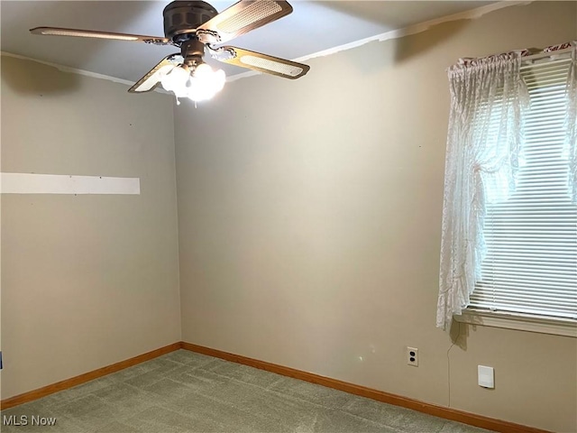 29000 Norman Ave, Wickliffe, OH 44092 - empty room with crown molding, ceiling fan, baseboards, and carpet