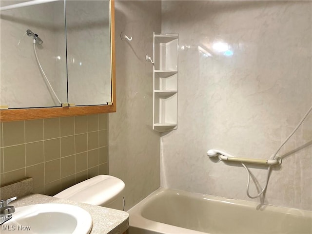 29000 Norman Ave, Wickliffe, OH 44092 - full bath featuring tub / shower combination, tile walls, toilet, vanity, and decorative backsplash