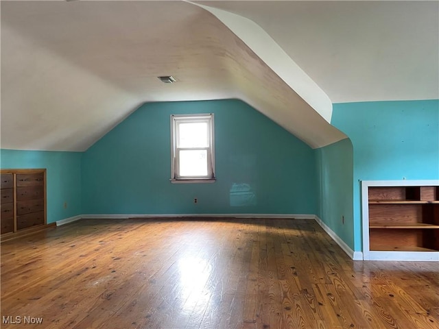 29000 Norman Ave, Wickliffe, OH 44092 - additional living space with hardwood / wood-style floors, lofted ceiling, and baseboards