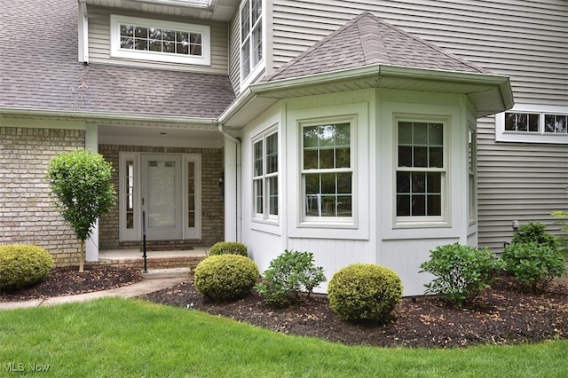 3691 Lexington Ct, Westlake, OH 44145 - property entrance featuring a shingled roof and brick siding