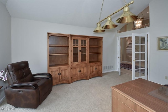 3691 Lexington Ct, Westlake, OH 44145 - sitting room featuring light colored carpet, a chandelier, high vaulted ceiling, and french doors
