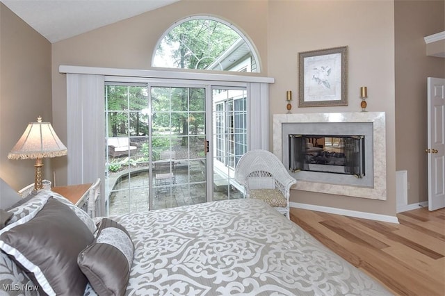 3691 Lexington Ct, Westlake, OH 44145 - living room featuring wood finished floors, a premium fireplace, high vaulted ceiling, and baseboards