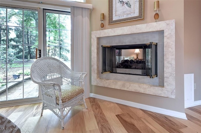 3691 Lexington Ct, Westlake, OH 44145 - living area with a high end fireplace, baseboards, and wood finished floors