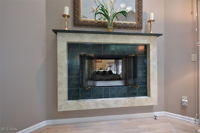 3691 Lexington Ct, Westlake, OH 44145 - detailed view of baseboards and a tile fireplace