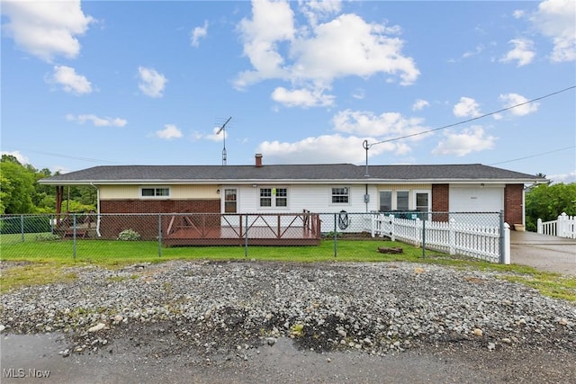 68951 Pine Terrace Rd, Bridgeport, OH 43912 - single story home with an attached garage, brick siding, concrete driveway, and a wooden deck