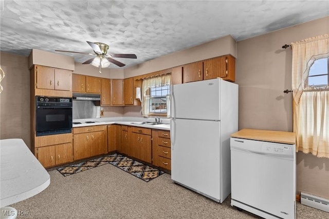68951 Pine Terrace Rd, Bridgeport, OH 43912 - kitchen featuring white appliances, a baseboard radiator, plenty of natural light, light countertops, and a textured ceiling