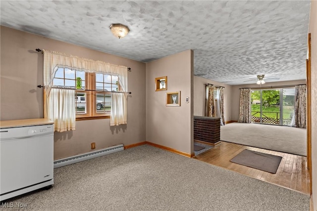 68951 Pine Terrace Rd, Bridgeport, OH 43912 - carpeted empty room featuring a baseboard radiator, baseboards, a textured ceiling, and a ceiling fan