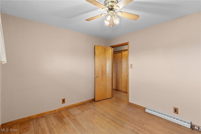 68951 Pine Terrace Rd, Bridgeport, OH 43912 - spare room featuring baseboard heating, baseboards, light wood finished floors, and a ceiling fan