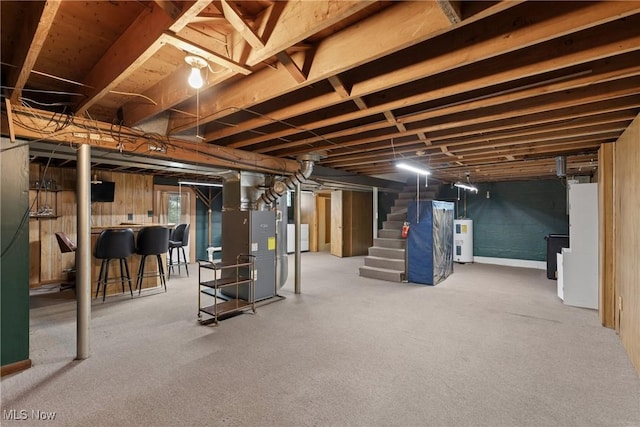 68951 Pine Terrace Rd, Bridgeport, OH 43912 - below grade area with electric water heater, stairway, and heating unit