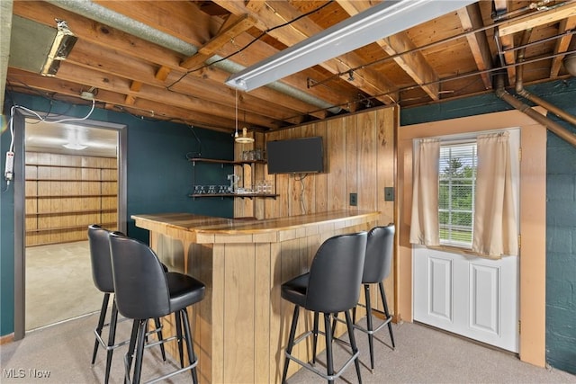 68951 Pine Terrace Rd, Bridgeport, OH 43912 - indoor dry bar featuring wood walls and hanging light fixtures