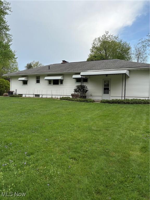 2499 Nesmith Lake Blvd, Akron, OH 44314 - rear view of property with a lawn