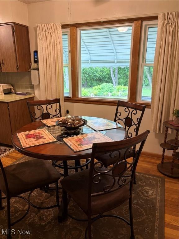 2499 Nesmith Lake Blvd, Akron, OH 44314 - dining space featuring plenty of natural light and wood finished floors