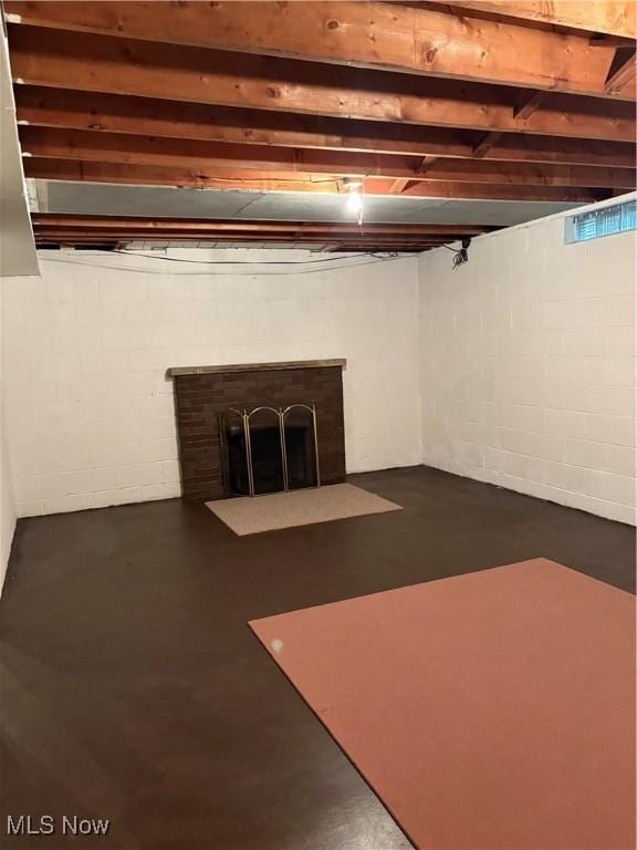 2499 Nesmith Lake Blvd, Akron, OH 44314 - basement with concrete block wall and a fireplace with flush hearth