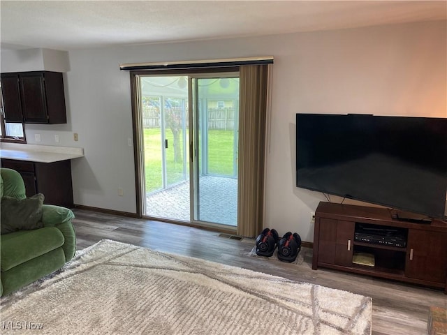 2733 W 37th St, Lorain, OH 44053 - living room featuring wood finished floors and baseboards