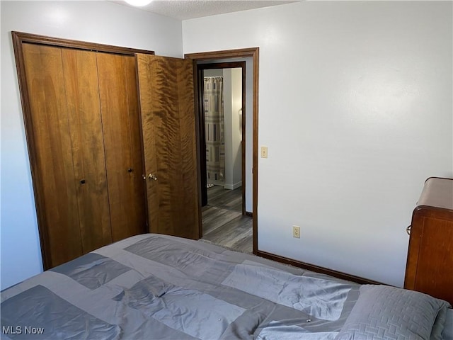 2733 W 37th St, Lorain, OH 44053 - bedroom featuring wood finished floors, a closet, and baseboards
