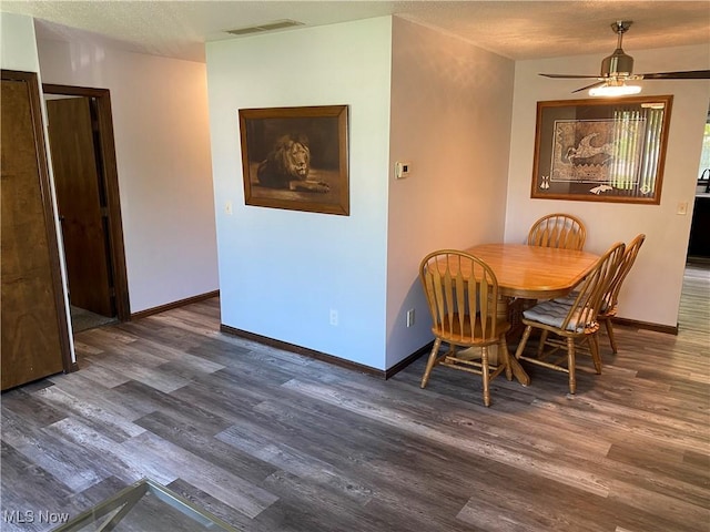 2733 W 37th St, Lorain, OH 44053 - dining room with wood finished floors, baseboards, and ceiling fan