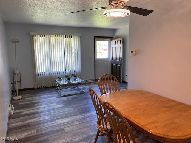 2733 W 37th St, Lorain, OH 44053 - dining room featuring ceiling fan, wood finished floors, a textured ceiling, and baseboards