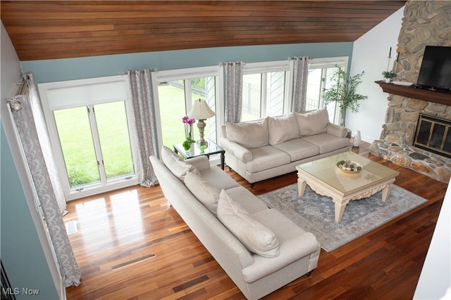 30907 Arlington Cir, Bay Village, OH 44140 - living room with vaulted ceiling, plenty of natural light, a fireplace, wooden ceiling, and wood finished floors