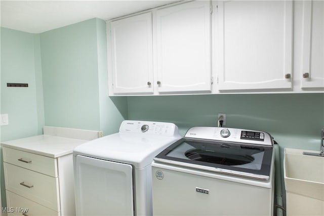 30907 Arlington Cir, Bay Village, OH 44140 - laundry room featuring cabinet space and washer and dryer