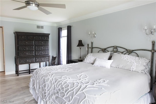 30907 Arlington Cir, Bay Village, OH 44140 - bedroom with wood finished floors, ornamental molding, and ceiling fan
