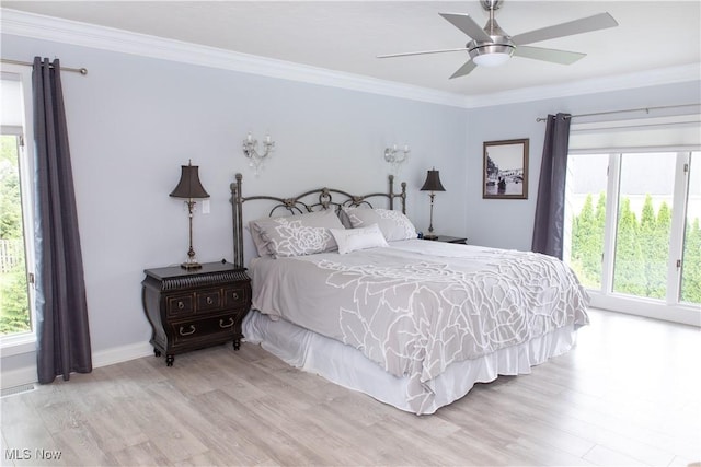 30907 Arlington Cir, Bay Village, OH 44140 - bedroom with light wood-style floors, crown molding, a ceiling fan, and baseboards