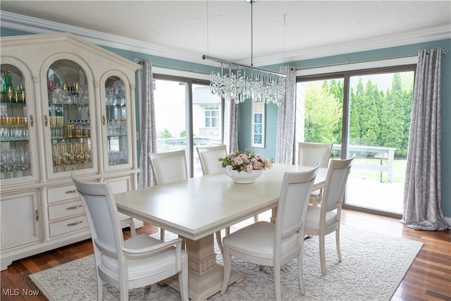 30907 Arlington Cir, Bay Village, OH 44140 - dining space with ornamental molding, dark wood-type flooring, and a chandelier
