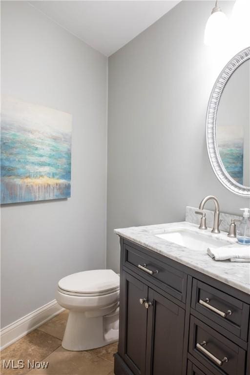 30907 Arlington Cir, Bay Village, OH 44140 - half bath featuring vanity, toilet, and baseboards
