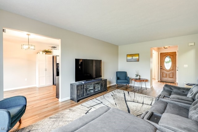2042 Summer Evening Dr, Canal Fulton, OH 44614 - living room with light wood finished floors and baseboards