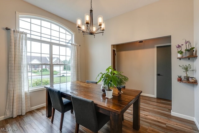 2042 Summer Evening Dr, Canal Fulton, OH 44614 - dining area featuring a chandelier, baseboards, and wood finished floors