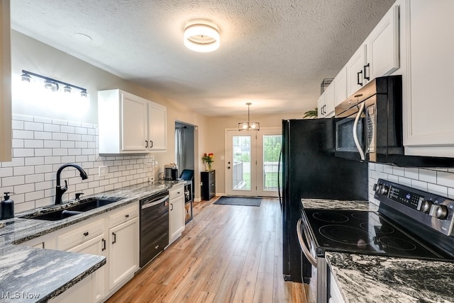 2042 Summer Evening Dr, Canal Fulton, OH 44614 - kitchen with appliances with stainless steel finishes, a sink, white cabinets, stone countertops, and a textured ceiling