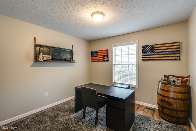 2042 Summer Evening Dr, Canal Fulton, OH 44614 - office area with a textured ceiling, baseboards, and wood finished floors
