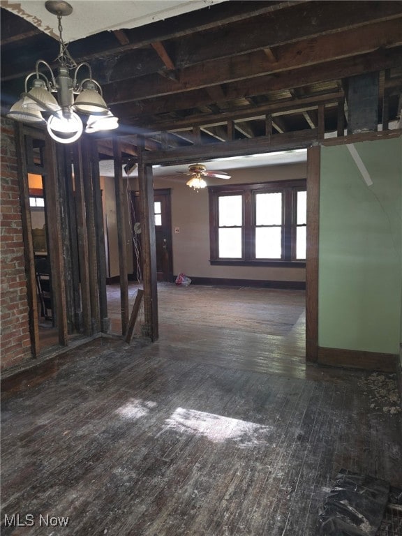 1119 W 11th St, Lorain, OH 44052 - basement featuring wood-type flooring, a chandelier, and baseboards