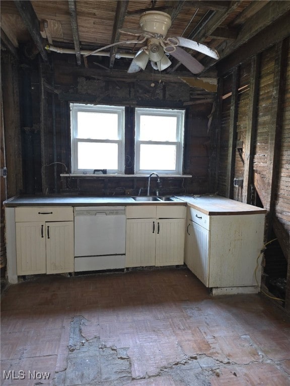 1119 W 11th St, Lorain, OH 44052 - kitchen featuring white dishwasher, a sink, and a ceiling fan
