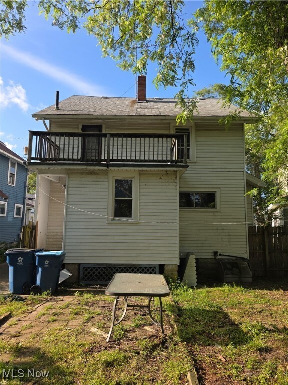 1119 W 11th St, Lorain, OH 44052 - back of house featuring a balcony and a chimney