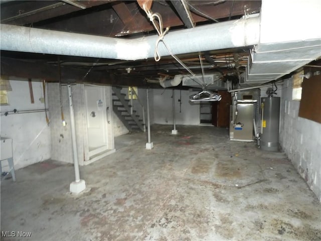 1020 Virginia St, Martins Ferry, OH 43935 - unfinished basement featuring water heater, stairway, and heating unit