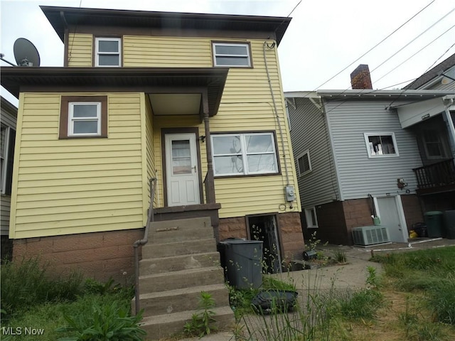 1020 Virginia St, Martins Ferry, OH 43935 - back of house with entry steps and central AC unit