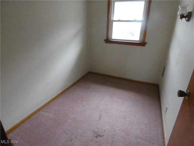 1020 Virginia St, Martins Ferry, OH 43935 - empty room with carpet flooring and baseboards