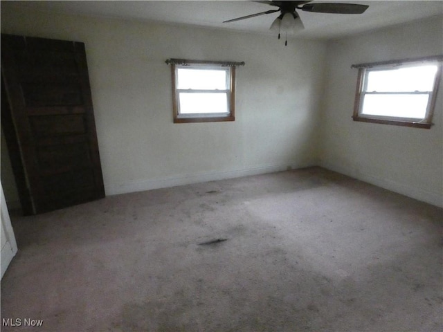 1020 Virginia St, Martins Ferry, OH 43935 - carpeted empty room featuring a ceiling fan and baseboards