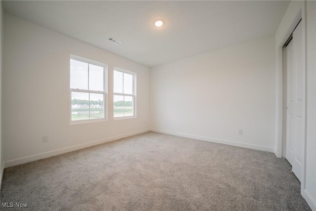 401 Pheasant Run, Elyria, OH 44035 - unfurnished bedroom with carpet flooring, baseboards, and a closet