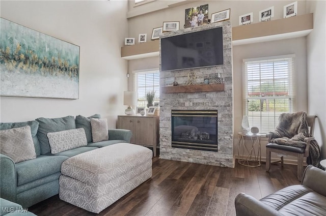 8550 Ivy Hill Dr Unit 16, Poland, OH 44514 - living area with dark wood finished floors, a fireplace, and a towering ceiling