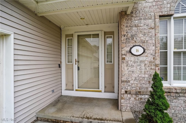 8550 Ivy Hill Dr Unit 16, Poland, OH 44514 - doorway to property with a security system and stone siding