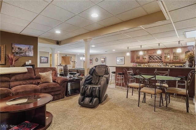 8550 Ivy Hill Dr Unit 16, Poland, OH 44514 - carpeted living room with decorative columns, bar area, a drop ceiling, and recessed lighting